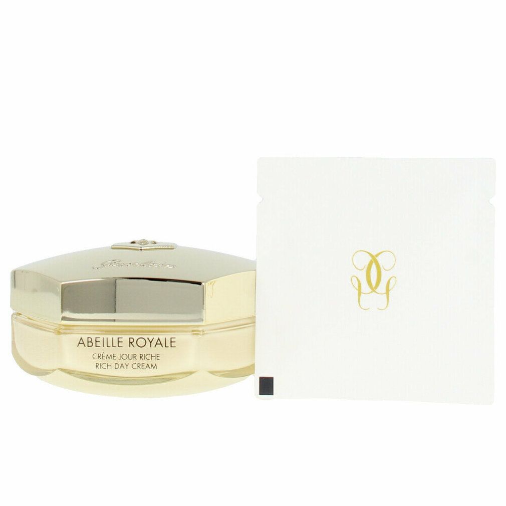 Vasetto di crema con coperchio dorato. Scritta: Abeille Royale Crème Jour Riche. Astuccio bianco con logo dorato. Prodotto su sfondo bianco.