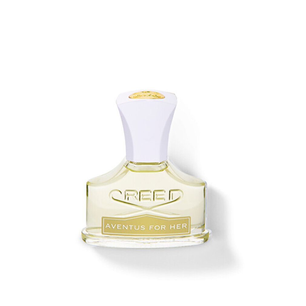 Flacone di profumo con tappo bianco. Scritta: Creed, Aventus for Her. Liquido giallo visibile.