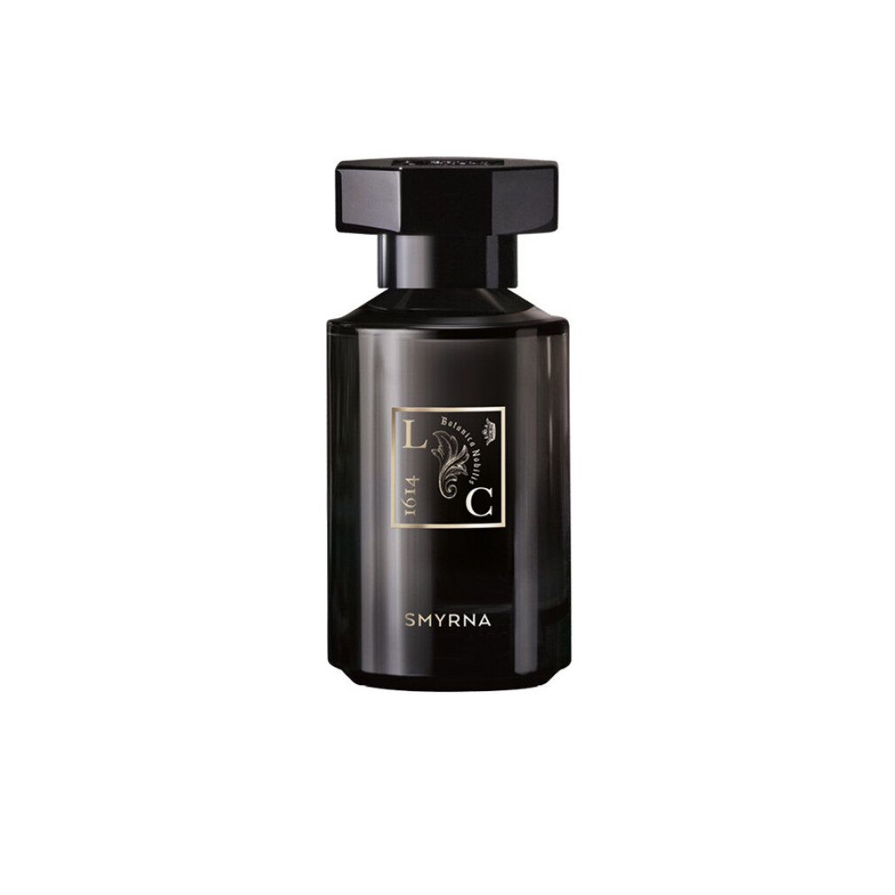 Flacone in vetro nero con tappo nero. Etichetta dorata con scritta "Smyrna".
