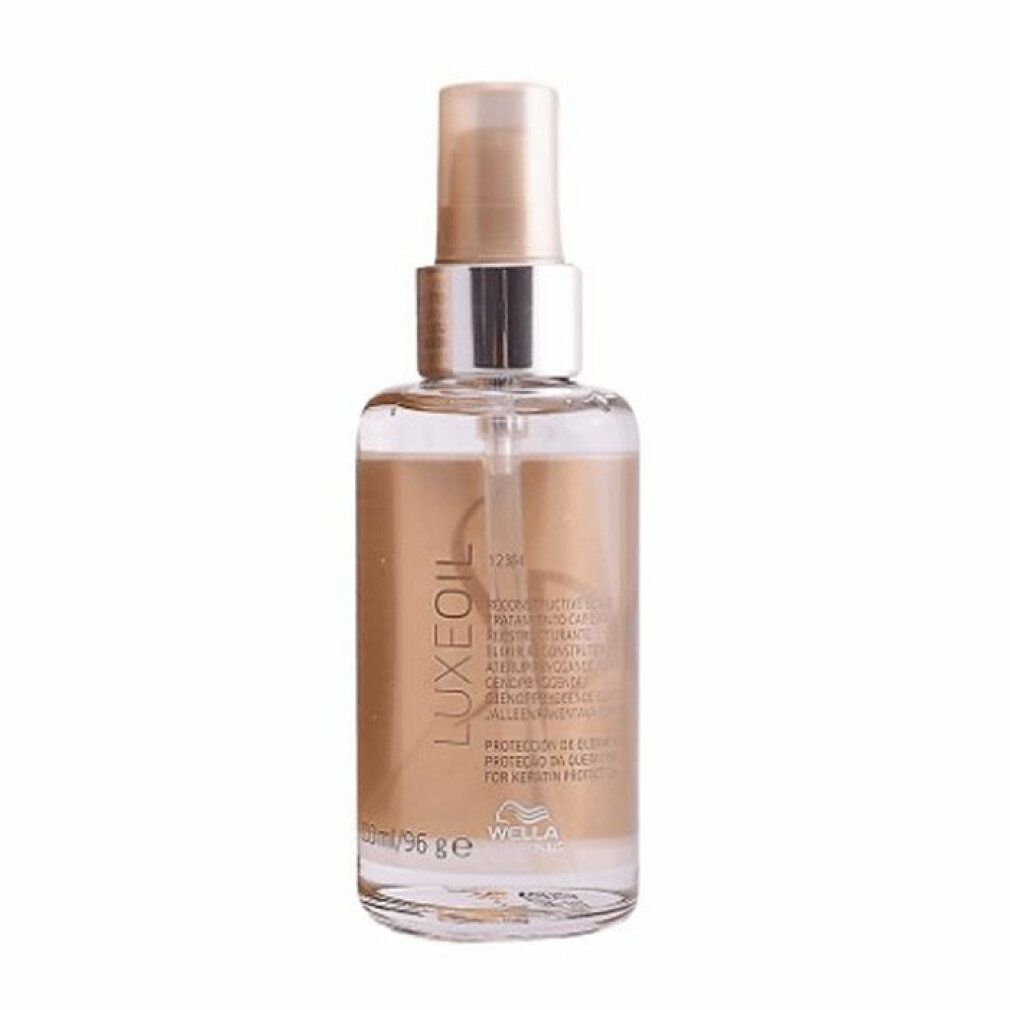 Flacone trasparente con contenuto dorato. Scritta: SP LuxeOil. Marchio: Wella Professionals. Volume: 96 ml.