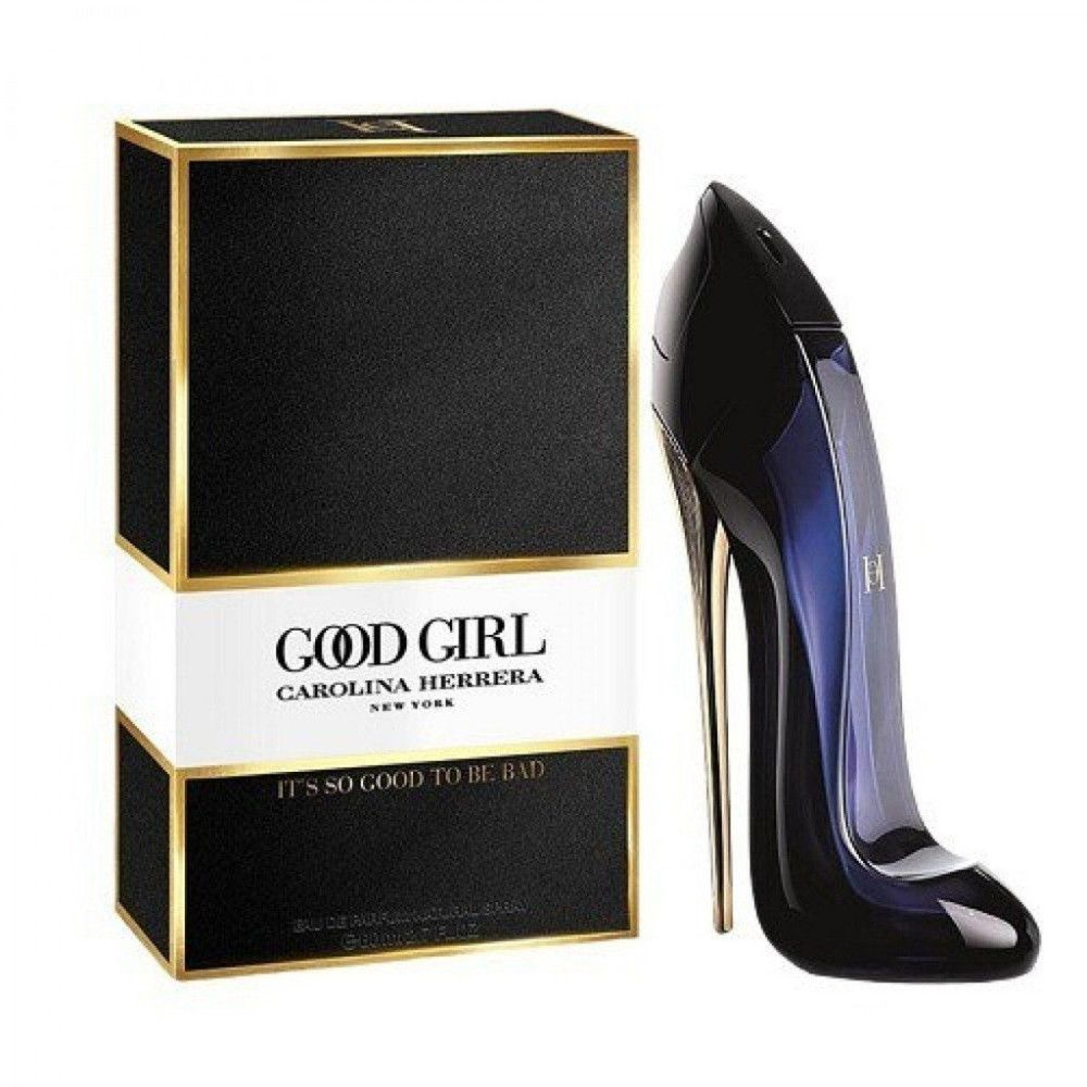 Scatola nera con bordi dorati e scritta 'Good Girl Carolina Herrera'. Accanto, un flacone a forma di tacco a spillo.