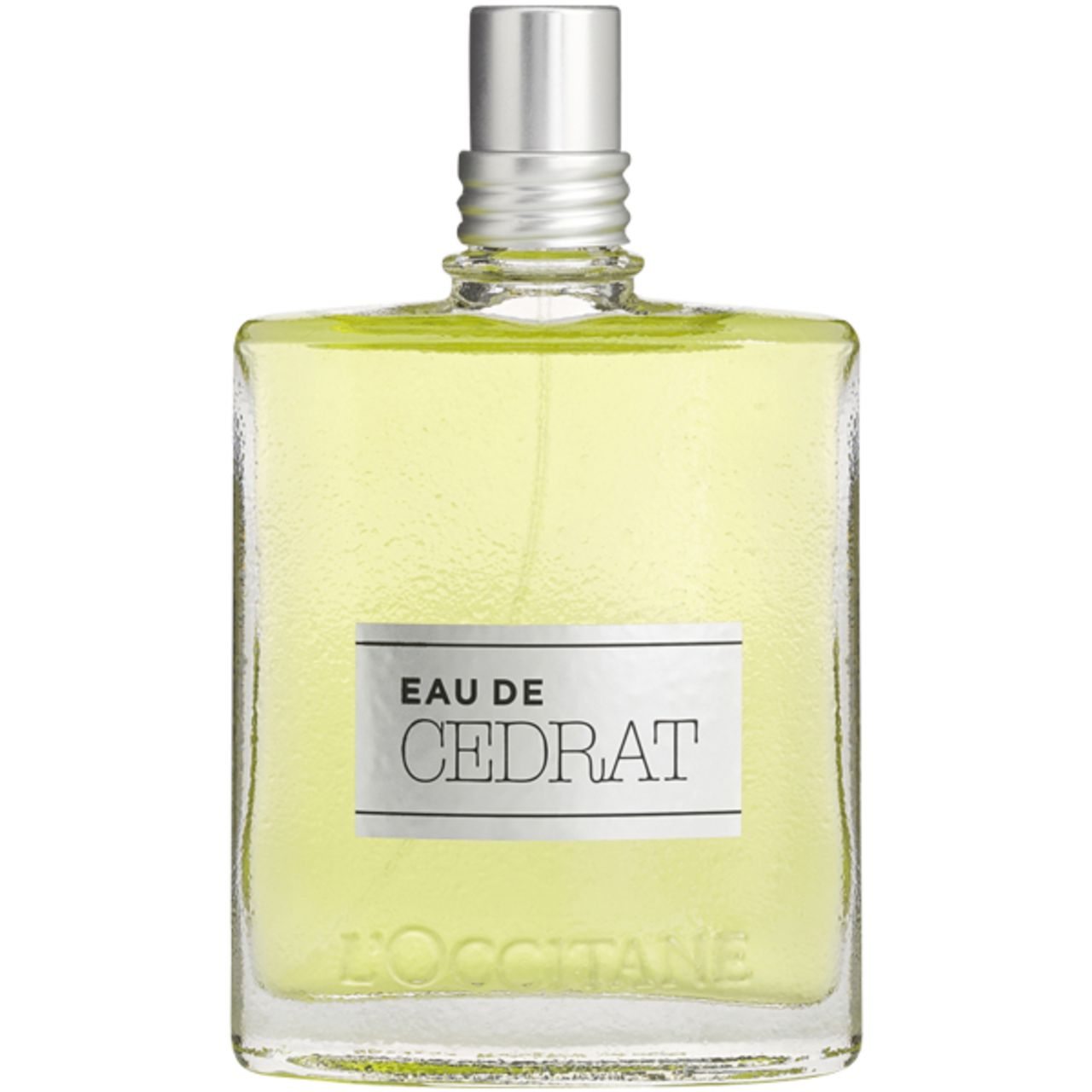 Flacone in vetro L'Occitane Eau de Cedrat. Scritta: Eau de Cedrat. Vaporizzatore argentato. Liquido giallastro.