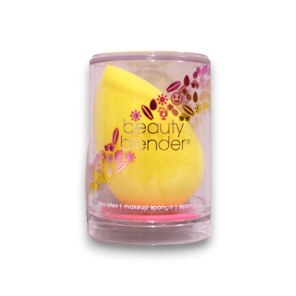 beautyblender Joy giallo in custodia trasparente. Scritta e motivo floreale. Forma a uovo.