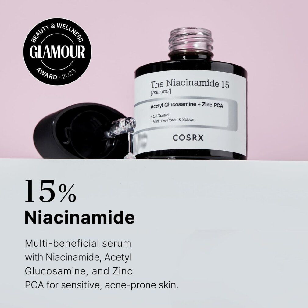 Flacone di siero con contagocce. Flacone nero, etichetta bianca. Premio Glamour 2023.