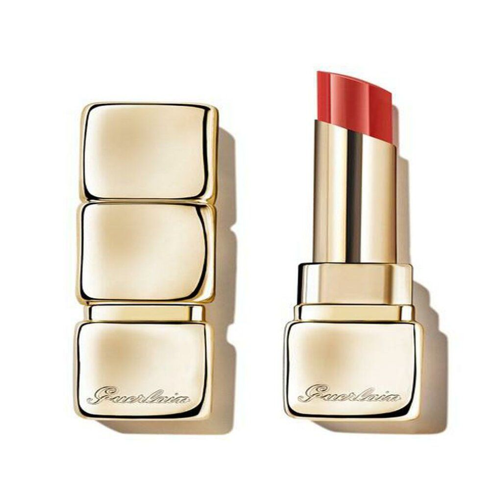 Rossetto dorato, aperto e chiuso. Mina rossa visibile. Logo Guerlain.
