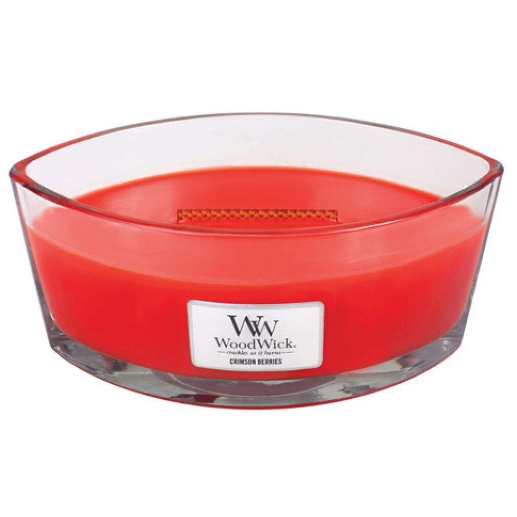 Candela rossa ellittica in vetro. Etichetta "Crimson Berries" e logo "WoodWick". Stoppino in legno visibile.