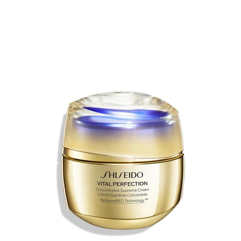 Vaso dorato con coperchio trasparente. Scritta: SHISEIDO, VITAL PERFECTION, Concentrated Supreme Cream, Crème Suprême Concentrée, ReNeuraRED Technology.