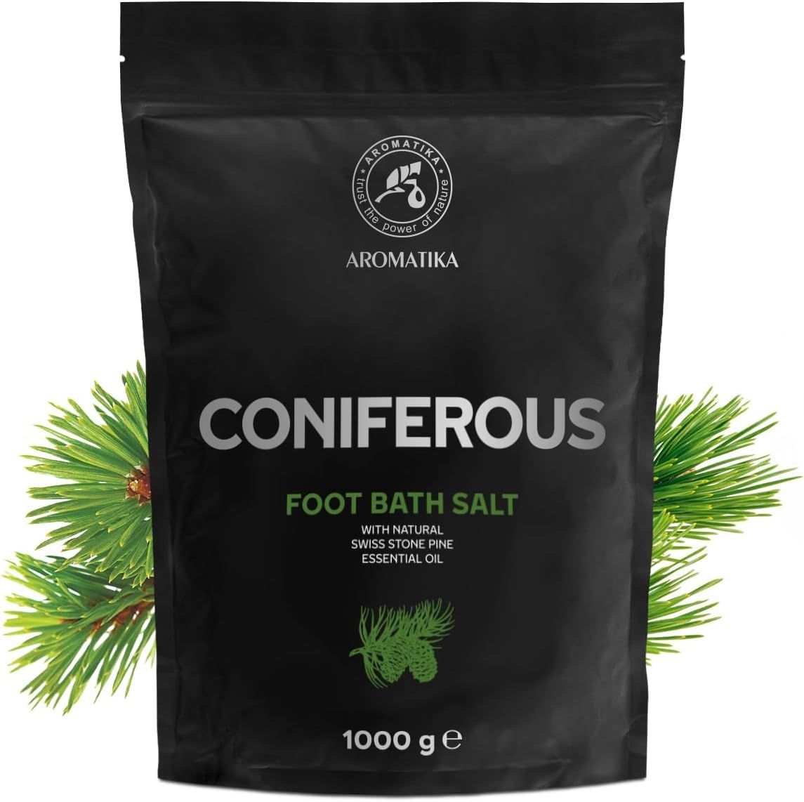 Confezione nera con nome CONIFEROUS e logo AROMATIKA. Contiene sale per pediluvio. 1000 g. Rametto di pino a sinistra.