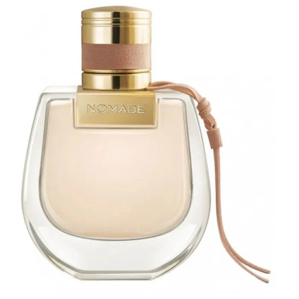 Flacone di profumo con tappo dorato e cinturino in pelle. Scritta: NOMADE.