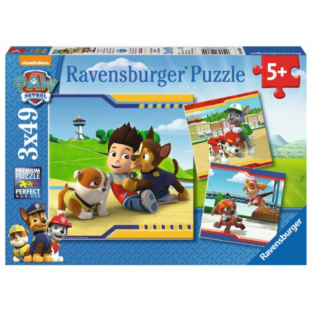 Scatola puzzle Paw Patrol. Contiene tre puzzle da 49 pezzi ciascuno. Età consigliata: 5+. Logo Ravensburger.