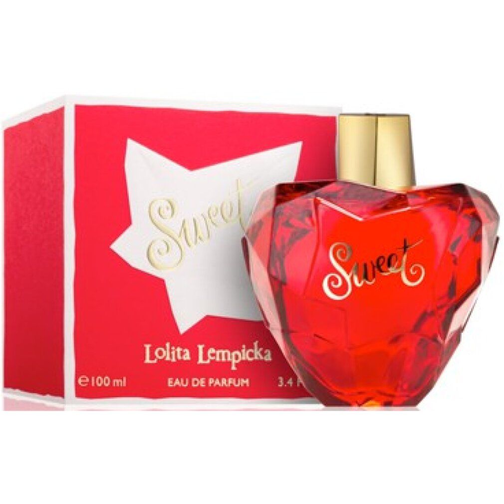 Flacone a cuore rosso con tappo dorato accanto alla confezione rossa con scritta Sweet. Eau de Parfum.