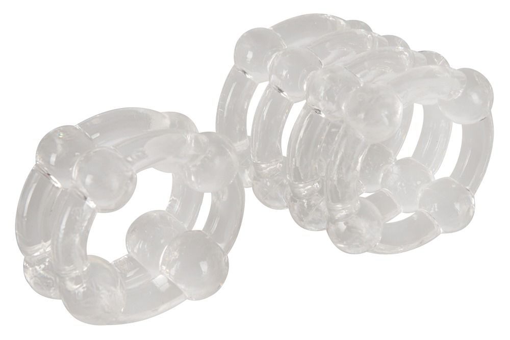 Due anelli trasparenti con elementi sferici. Gli anelli sono affiancati.