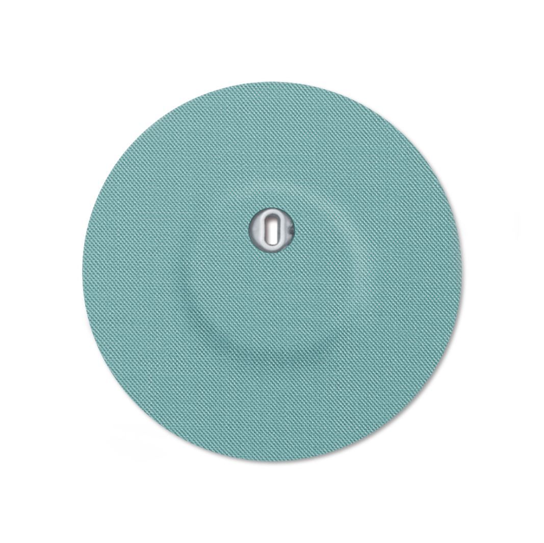 Cerotto rotondo turchese con foro di ventilazione. Parte metallica centrale.