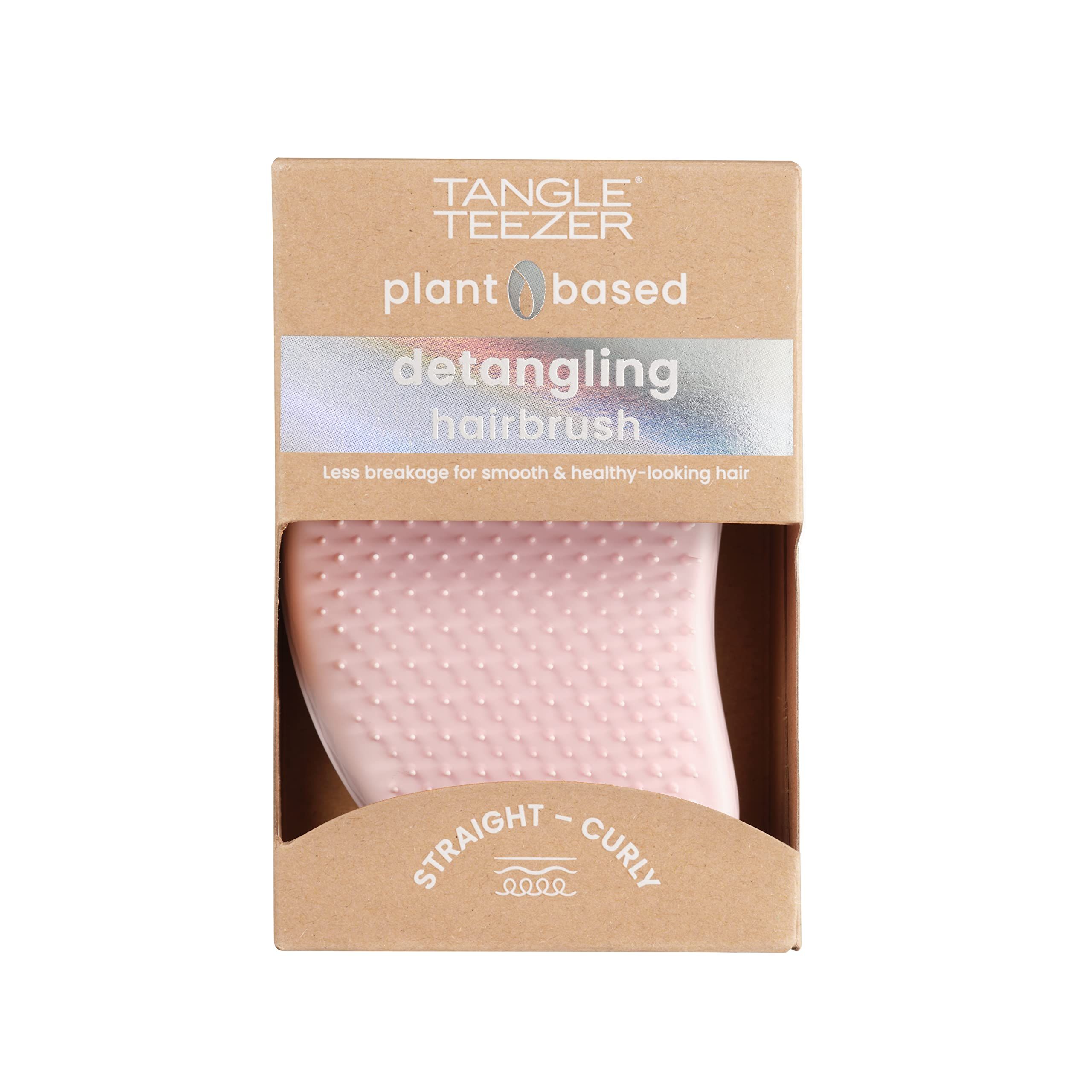 Confezione con spazzola rosa. Testo: plant based, detangling hairbrush.