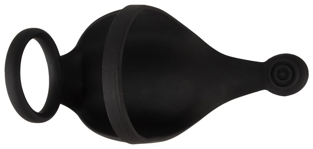 Anello per pene e scroto nero. Il prodotto ha una forma rotonda e una forma curva. È realizzato in materiale morbido.