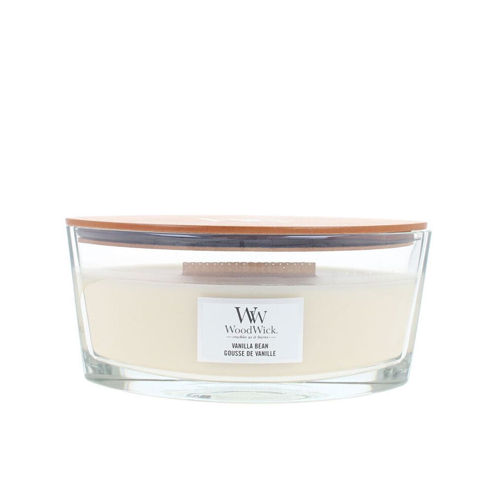 Candela in vetro, coperchio in legno. Etichetta "WoodWick Vanilla Bean".