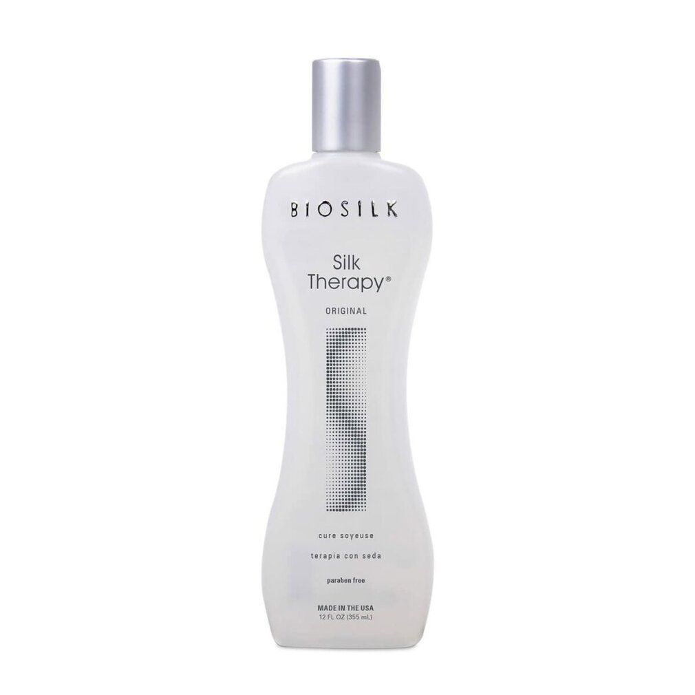 Flacone Biosilk Silk Therapy. Design bianco, sagomato, tappo argento. Testo: Silk Therapy Original, care essence, terapia con seda, paraben free.