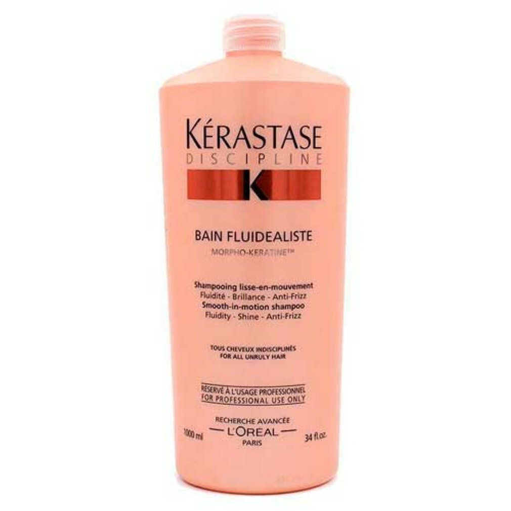 Flacone rosa di shampoo Kérastase Discipline Bain Fluidealiste. Scritta: Smooth-in-motion shampoo, per tutti i tipi di capelli.
