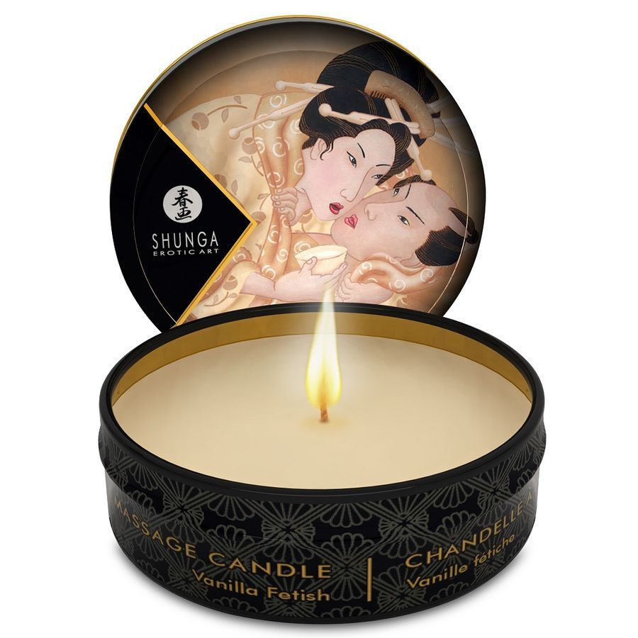 Candela da massaggio accesa in scatola nera, aroma vaniglia, motivo erotico.