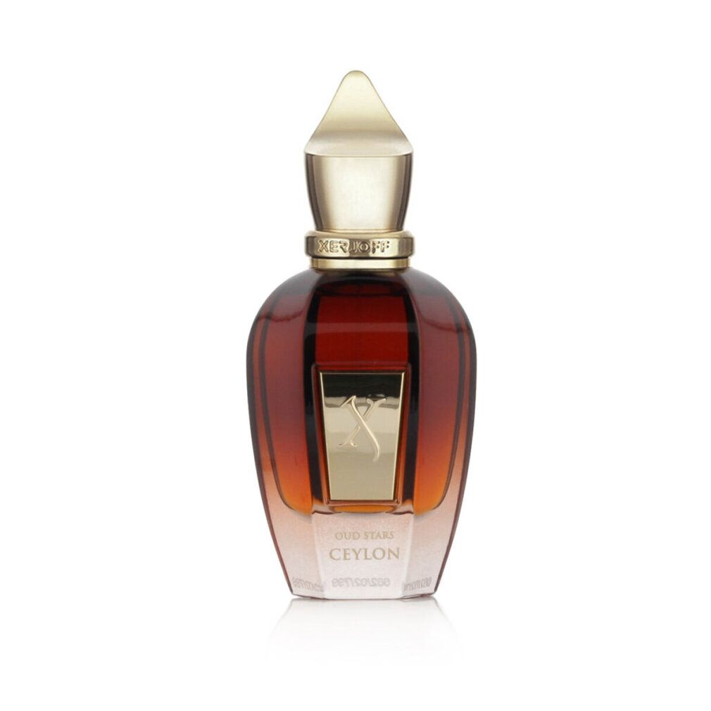 Flacone di profumo. Flacone marrone trasparente con tappo dorato. Scritta: OUD STARS CEYLON.