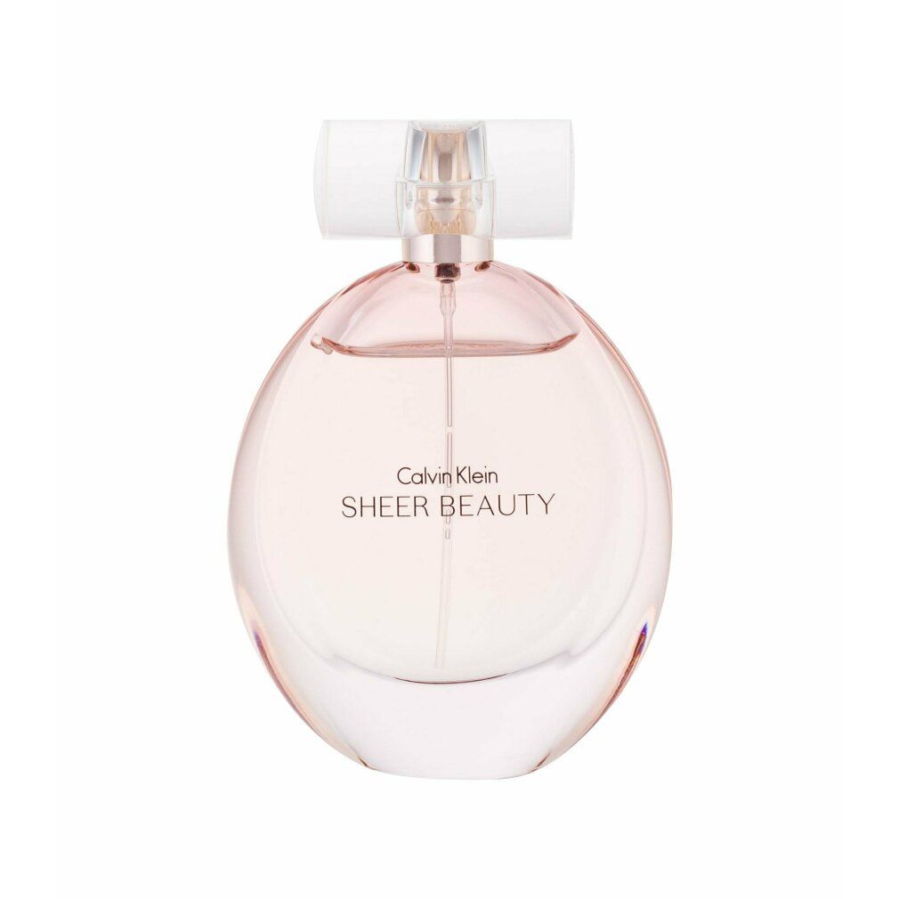 Flacone di profumo. Scritta: Calvin Klein Sheer Beauty. Flacone rotondo, liquido rosa.