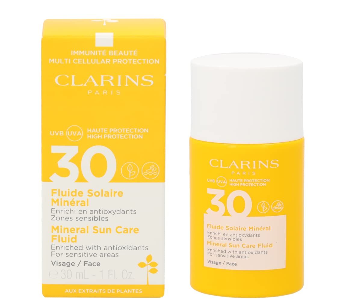 Confezione e flacone gialli. Scritta: Clarins, 30, Fluide Solaire Minéral, Mineral Sun Care Fluid. Per pelli sensibili.