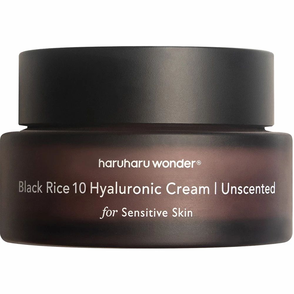 Vasetto marrone scuro con coperchio nero. Scritta: Black Rice 10 Hyaluronic Cream Unscented.