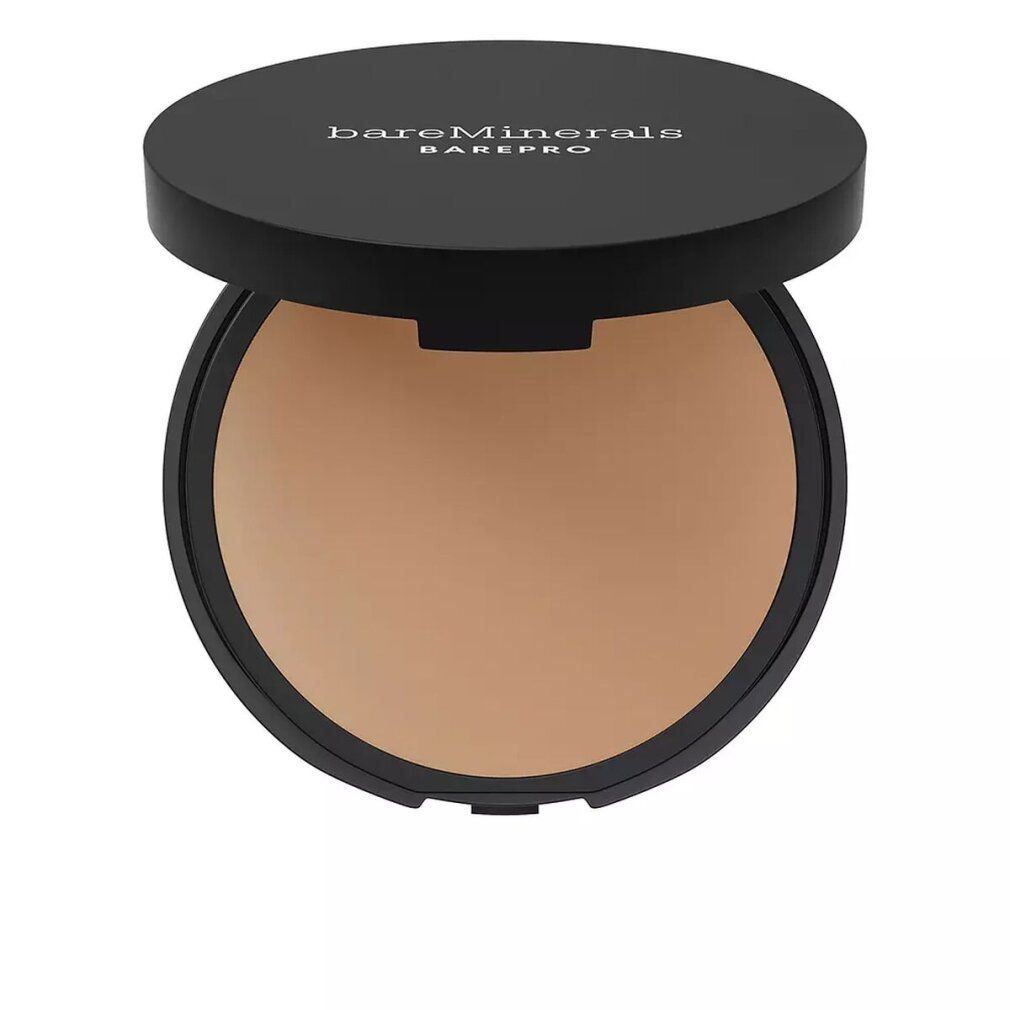 Contenitore rotondo nero con coperchio aperto. Trucco in polvere beige all'interno. Scritta bianca sul coperchio: bareMinerals BAREPRO.