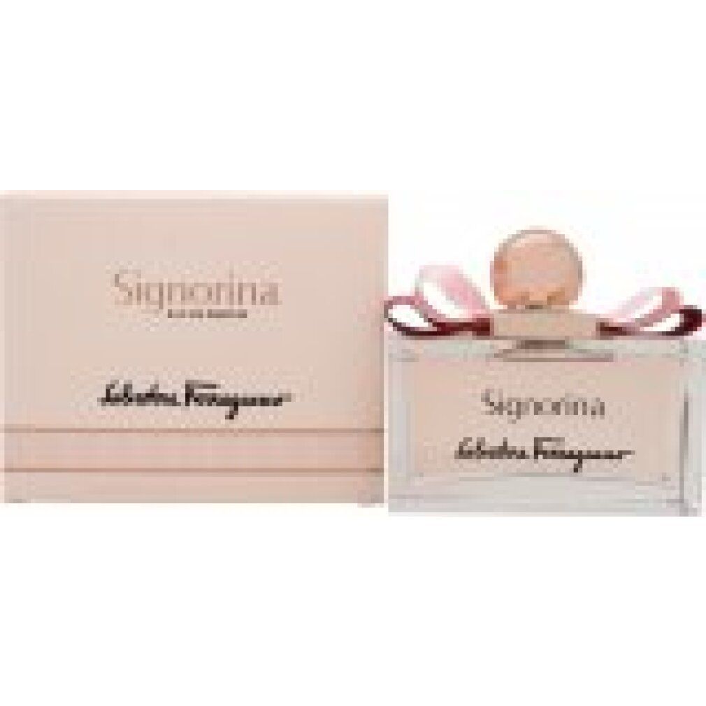 Flacone di profumo e confezione. Flacone con liquido rosa, fiocco e tappo dorato. Confezione con scritta Signorina.