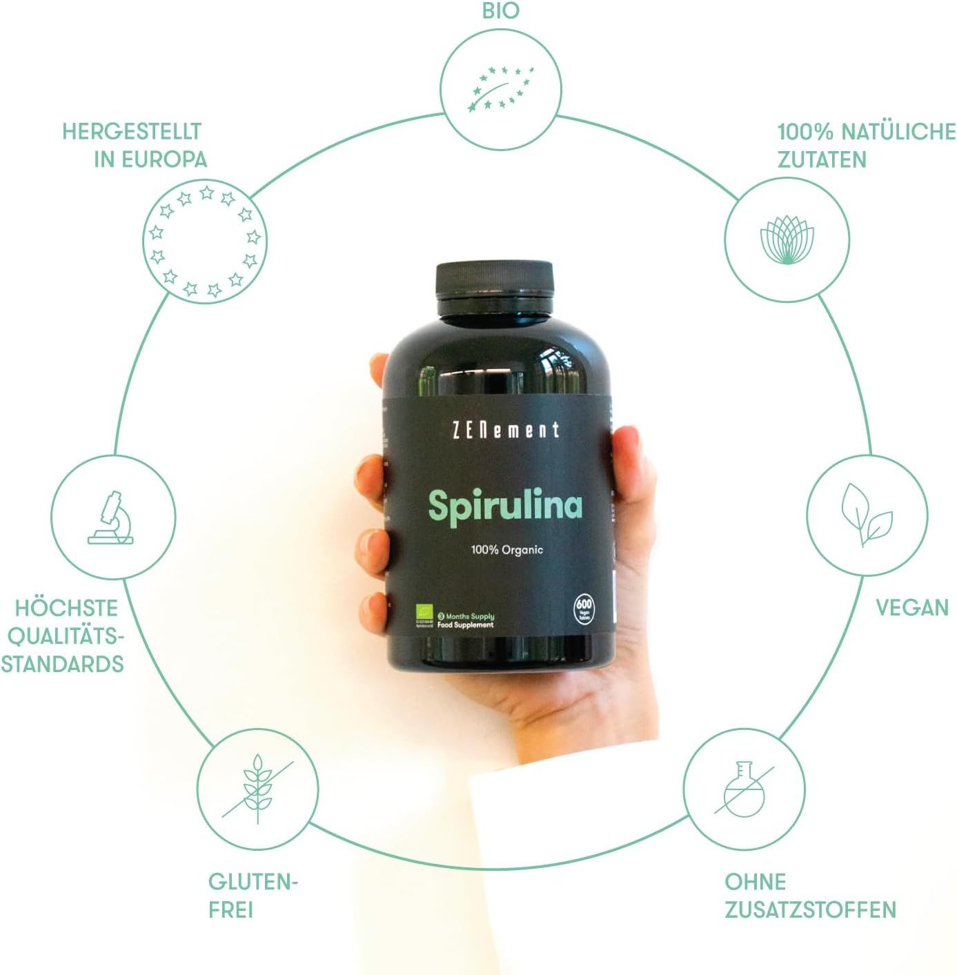Flacone nero di compresse di spirulina. Scritta: Zenement, Spirulina, 100% Organic. Marchio bio e altre informazioni.