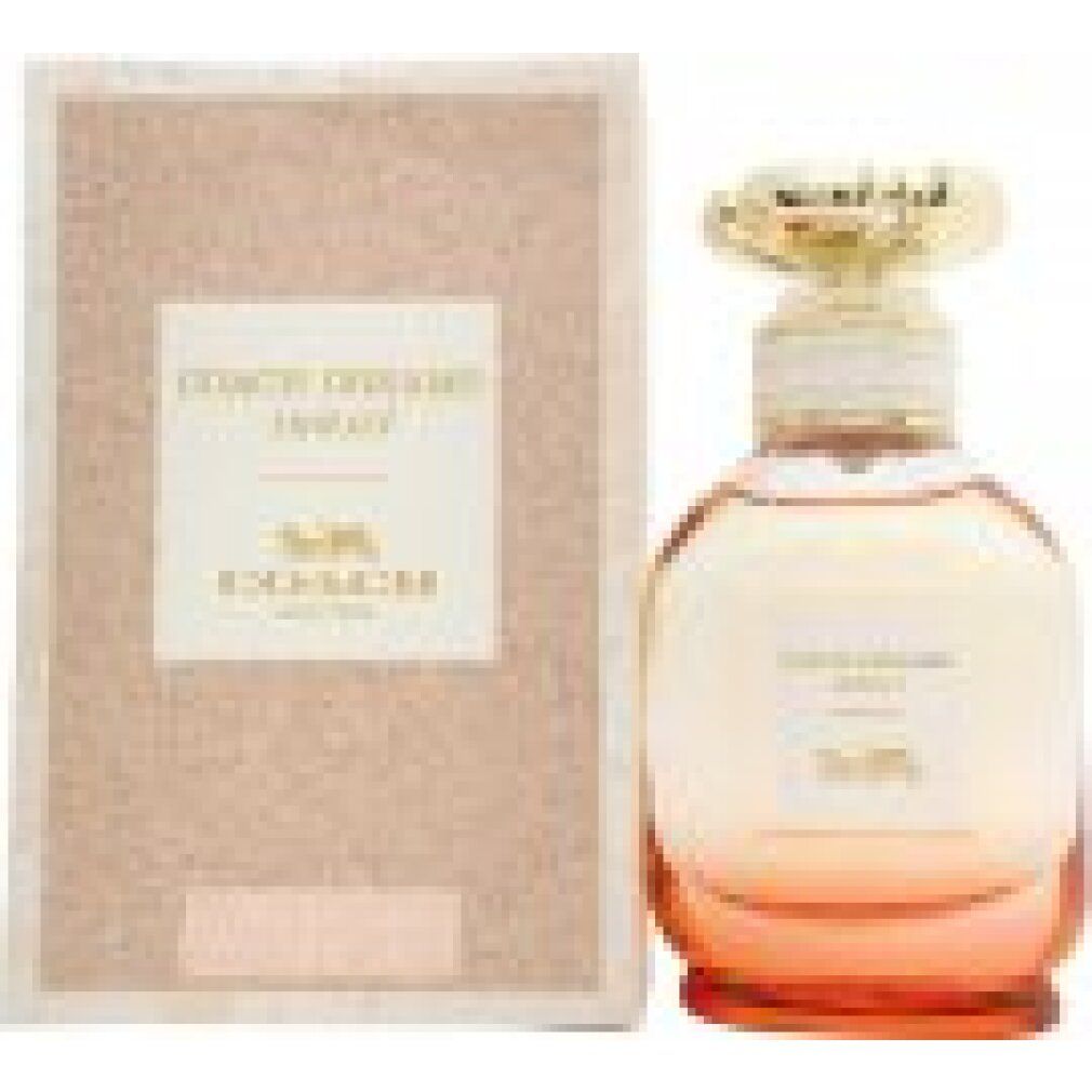 Flacone di profumo e confezione. L'etichetta riporta "COACH DREAMS sunset".