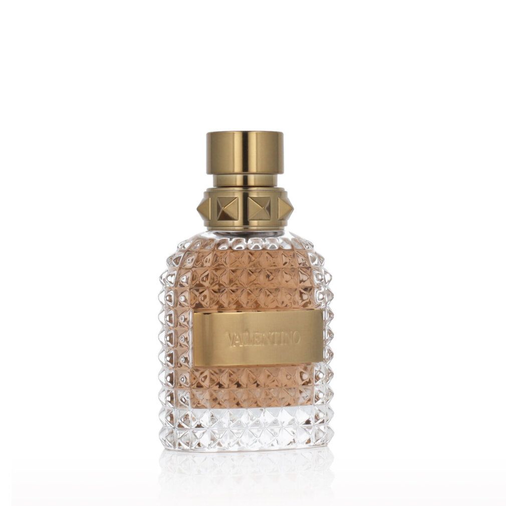 Valentino Uomo Eau de Toilette. Flacone in vetro con tappo dorato ed etichetta. Vetro goffrato.