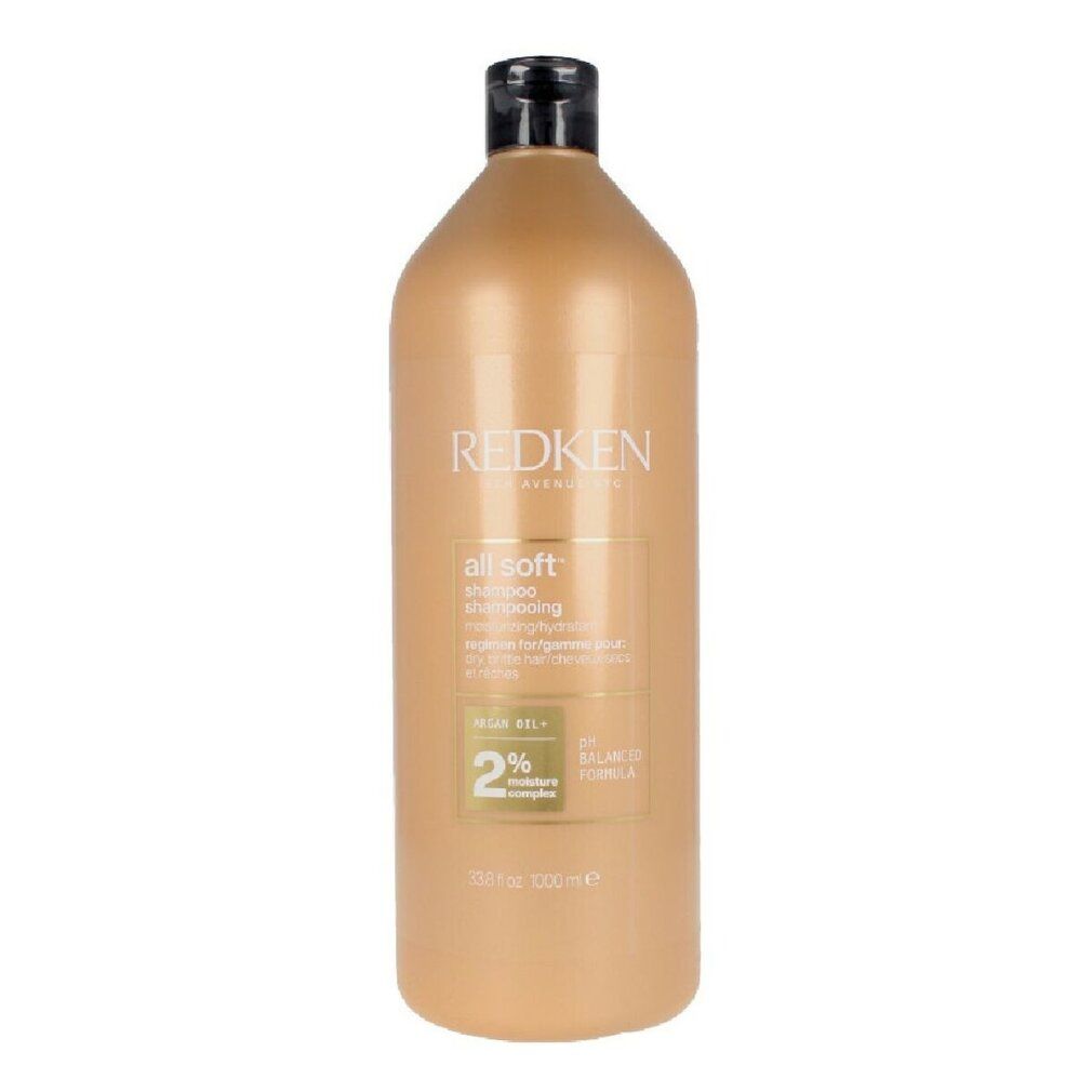Flacone di shampoo beige con tappo nero. Scritta: Redken, all soft shampoo. 2% Moisture Complex.