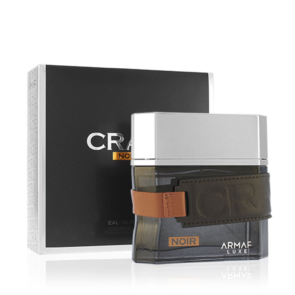 Flacone nero con cinturino in pelle marrone e confezione nera. Scritta: Craze Noir, Eau de Parfum, Armaf Luxe.