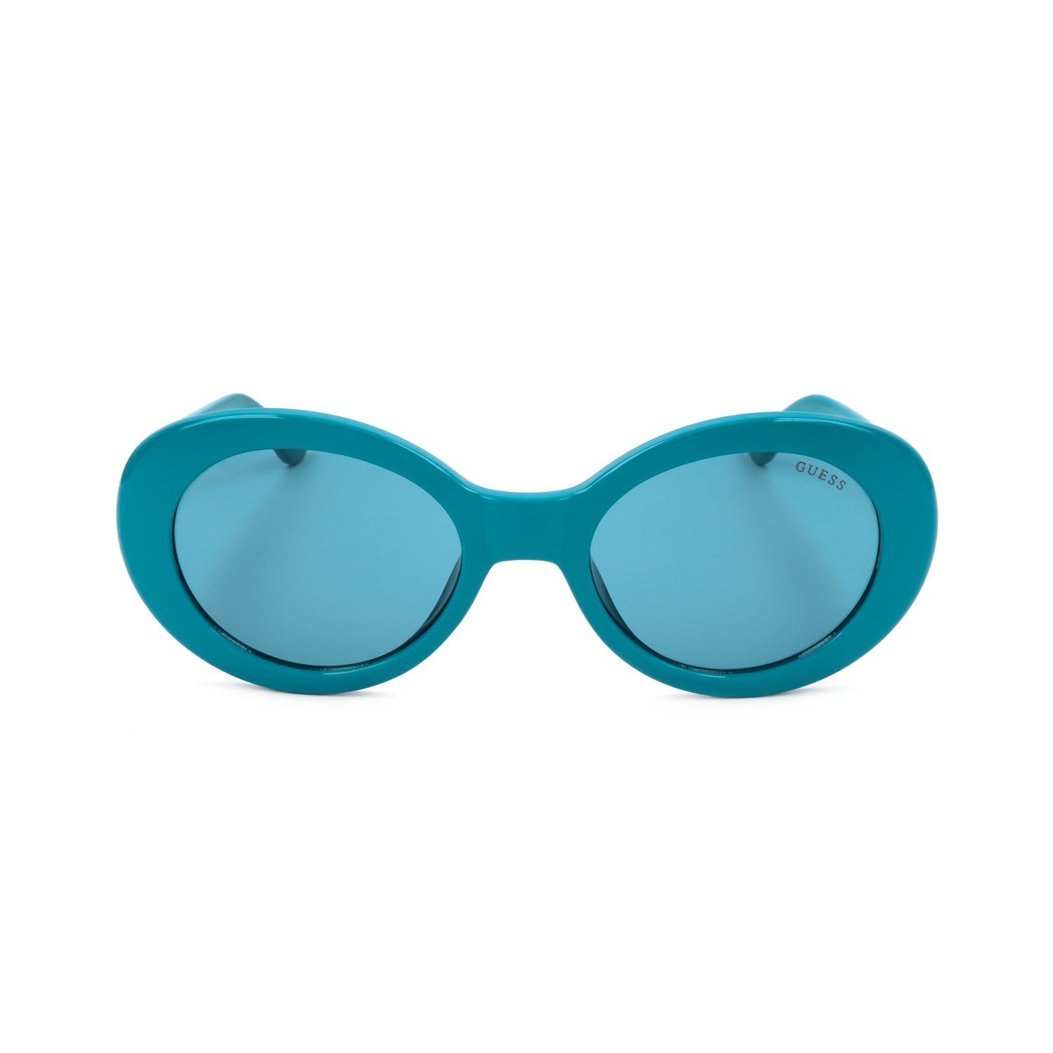Occhiali da sole da donna turchesi con lenti ovali e montatura spessa. Logo Guess sulla lente destra.