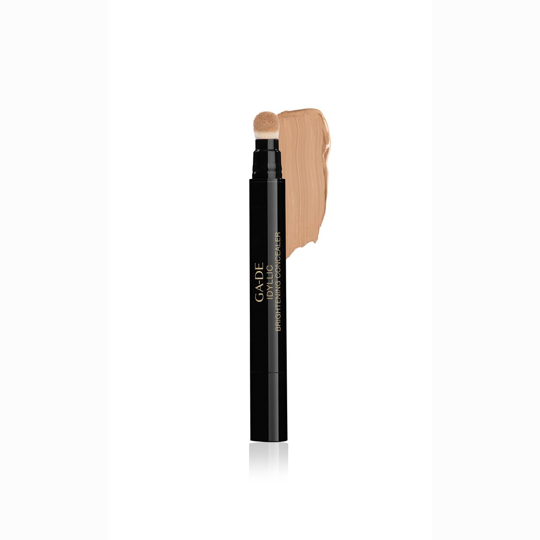 Correttore in stick nero con applicatore a spugna e campione di colore. Scritta: Ga-De Idyllic Brightening Concealer.