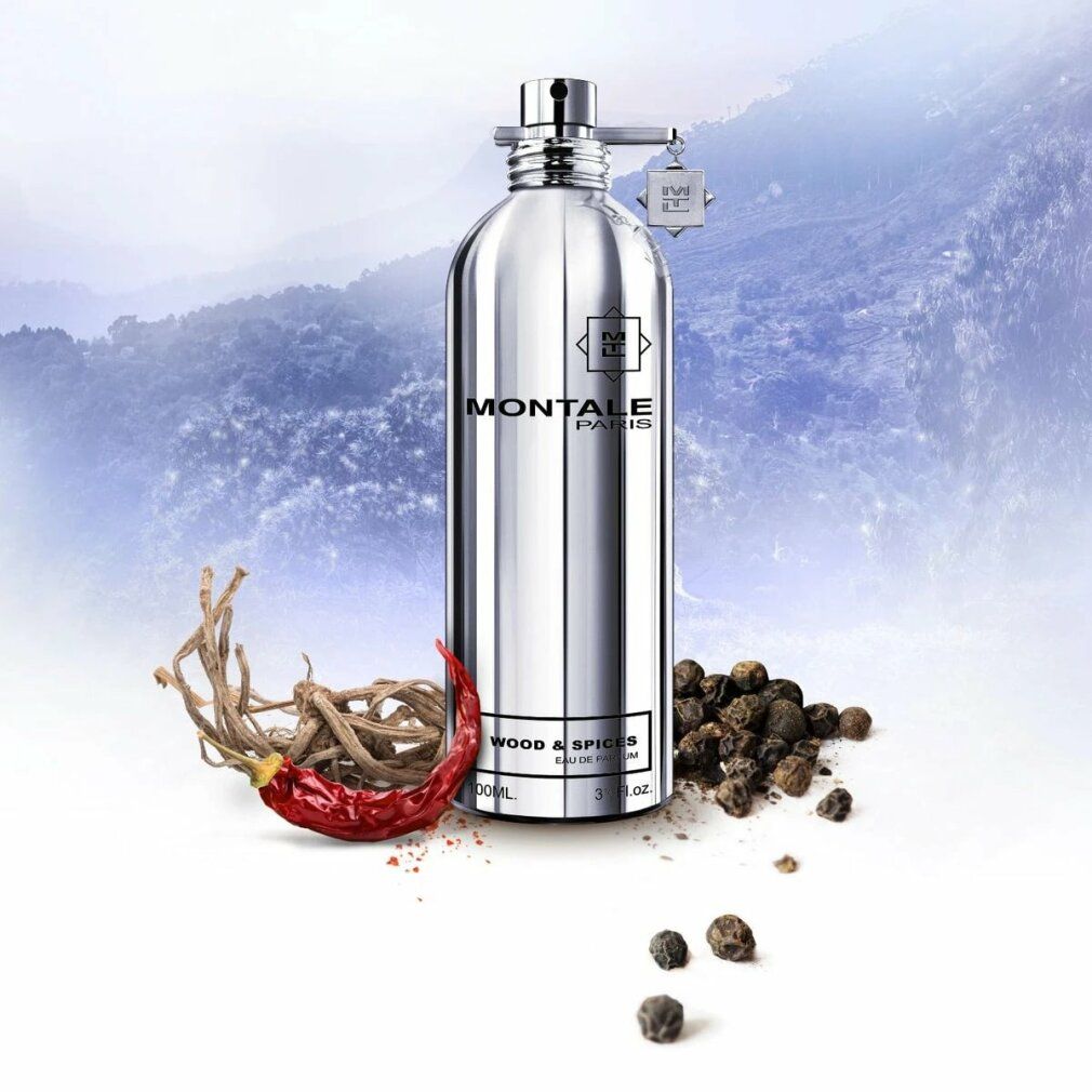Flacone di profumo argentato con scritta: MONTALE PARIS, WOOD & SPICES, Eau de Parfum. Con spezie.