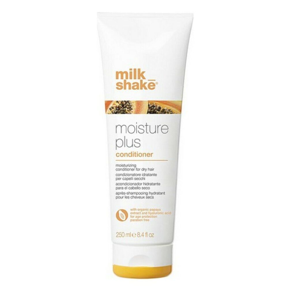 Tubo bianco con tappo arancione. Scritta: milk_shake moisture plus conditioner. Testo multilingue.