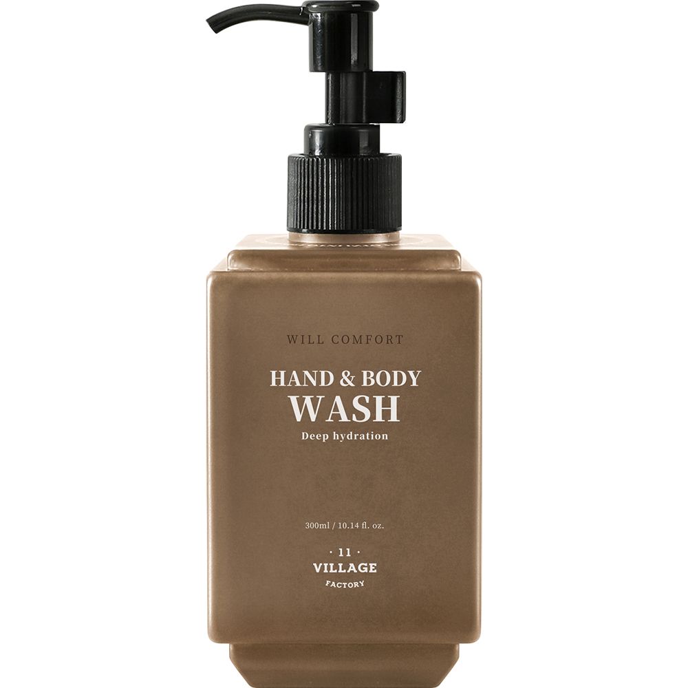 Flacone marrone con erogatore nero. Scritta: WILL COMFORT HAND & BODY WASH. Marchio: VILLAGE 11 FACTORY.
