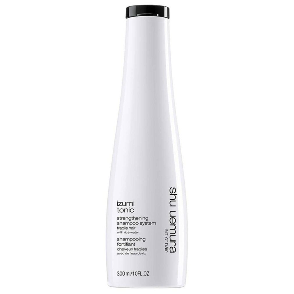 Flacone bianco con tappo nero. Testo: Izumi Tonic, Strengthening Shampoo System, Shu Uemura Art of Hair. 300ml/10FL.OZ.