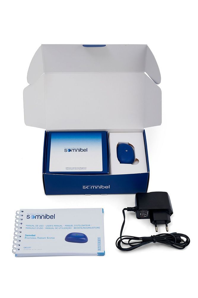 Confezione aperta con dispositivo, manuale e alimentatore. Scritta 'somnibel'.