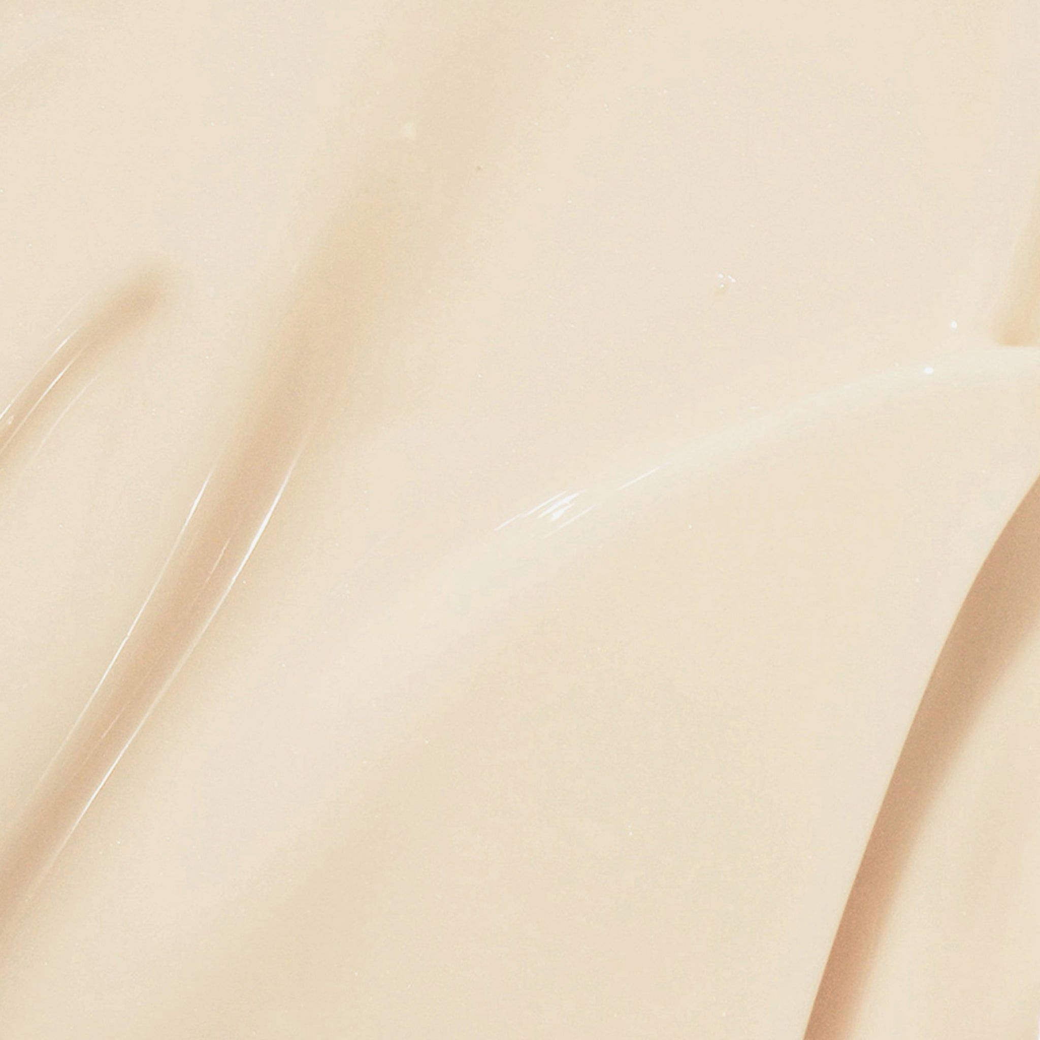 Primo piano di una crema. Texture color crema con superficie lucida.