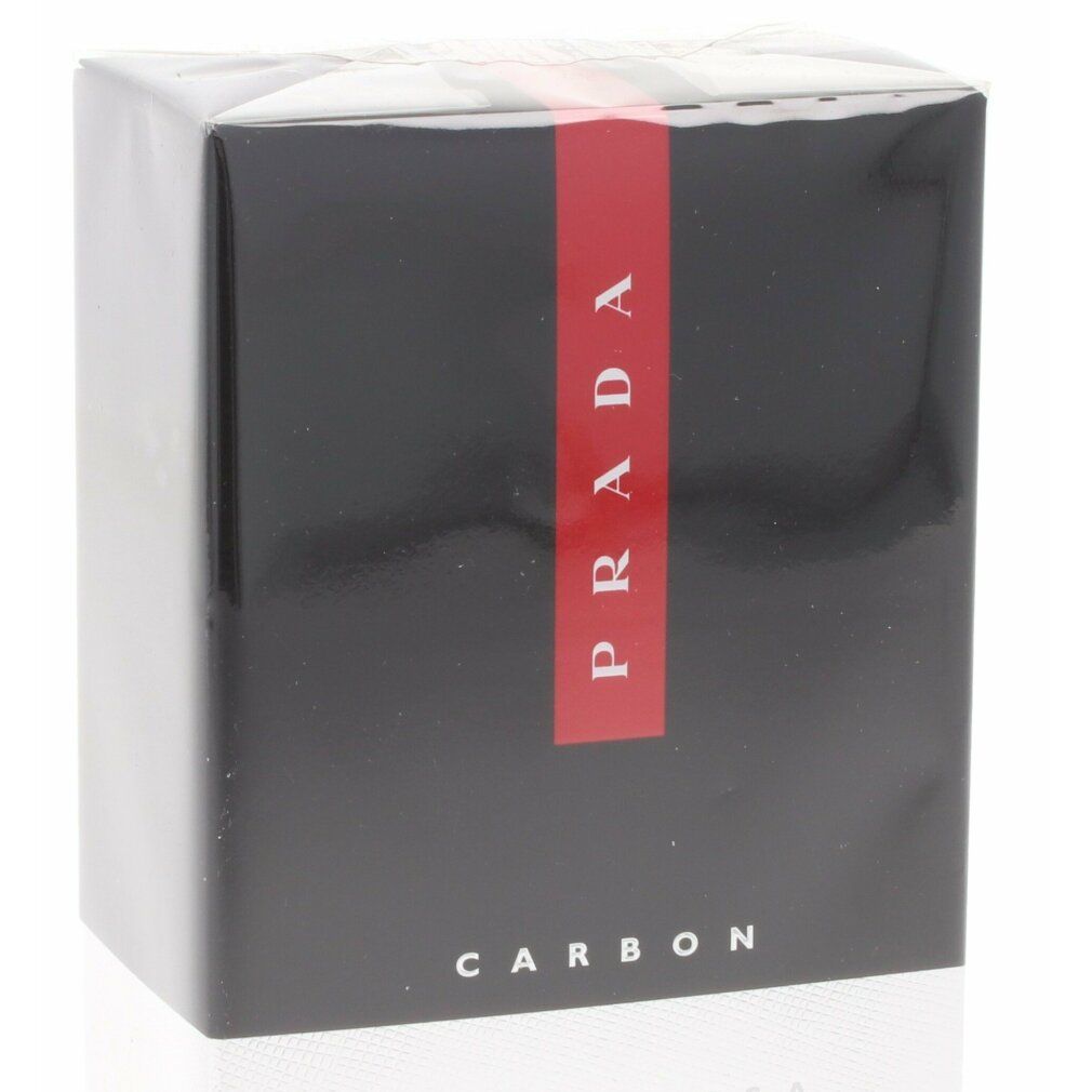 Confezione Prada Luna Rossa Carbon. Scatola nera, striscia rossa con logo Prada. Testo: CARBON.