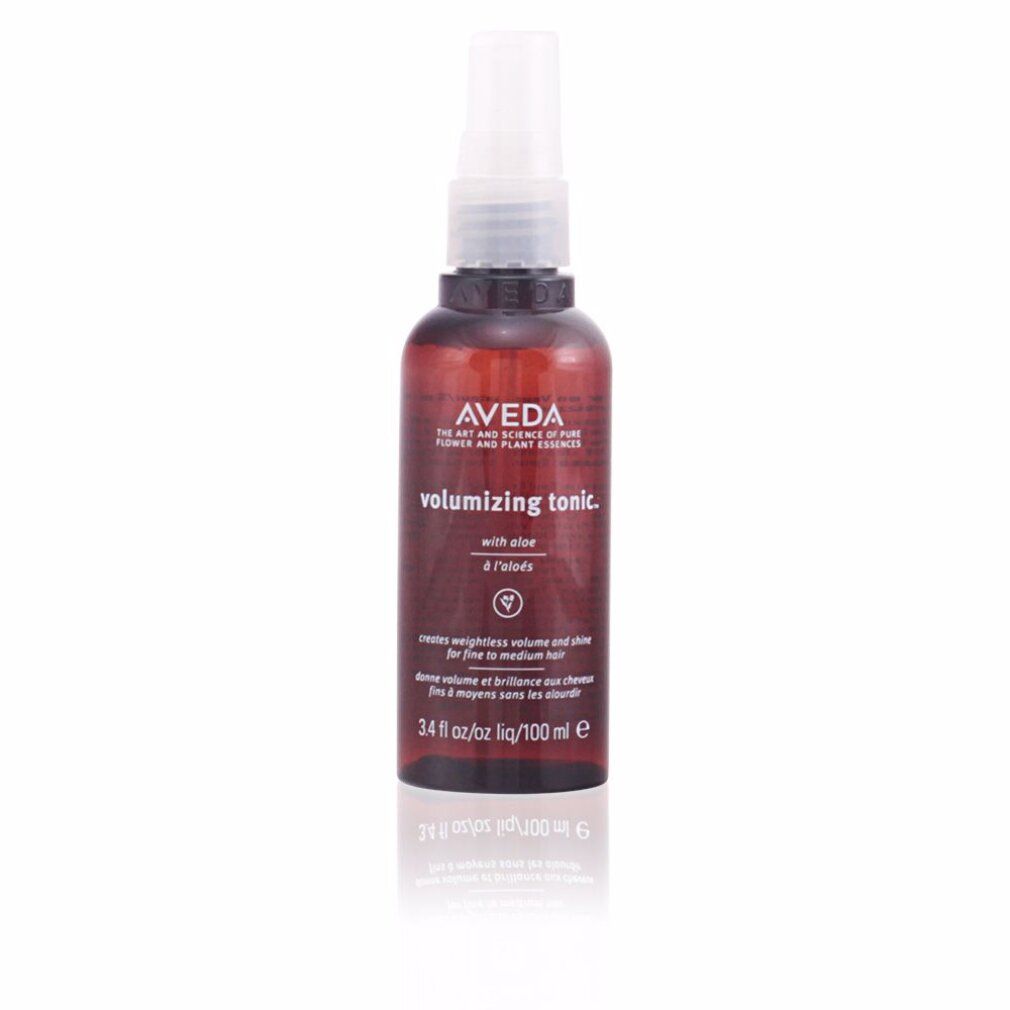 Flacone spray marrone con erogatore bianco. Scritta: Aveda, volumizing tonic, con Aloe. 3.4 fl oz/oz liq/100 ml e.