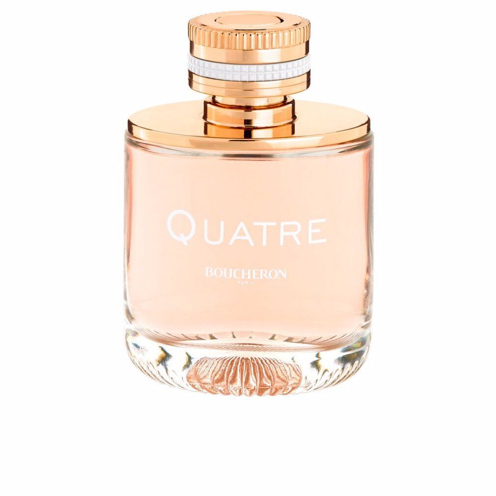 Flacone di profumo con tappo dorato e anello bianco. Scritta: Quatre, Boucheron. Liquido rosa.