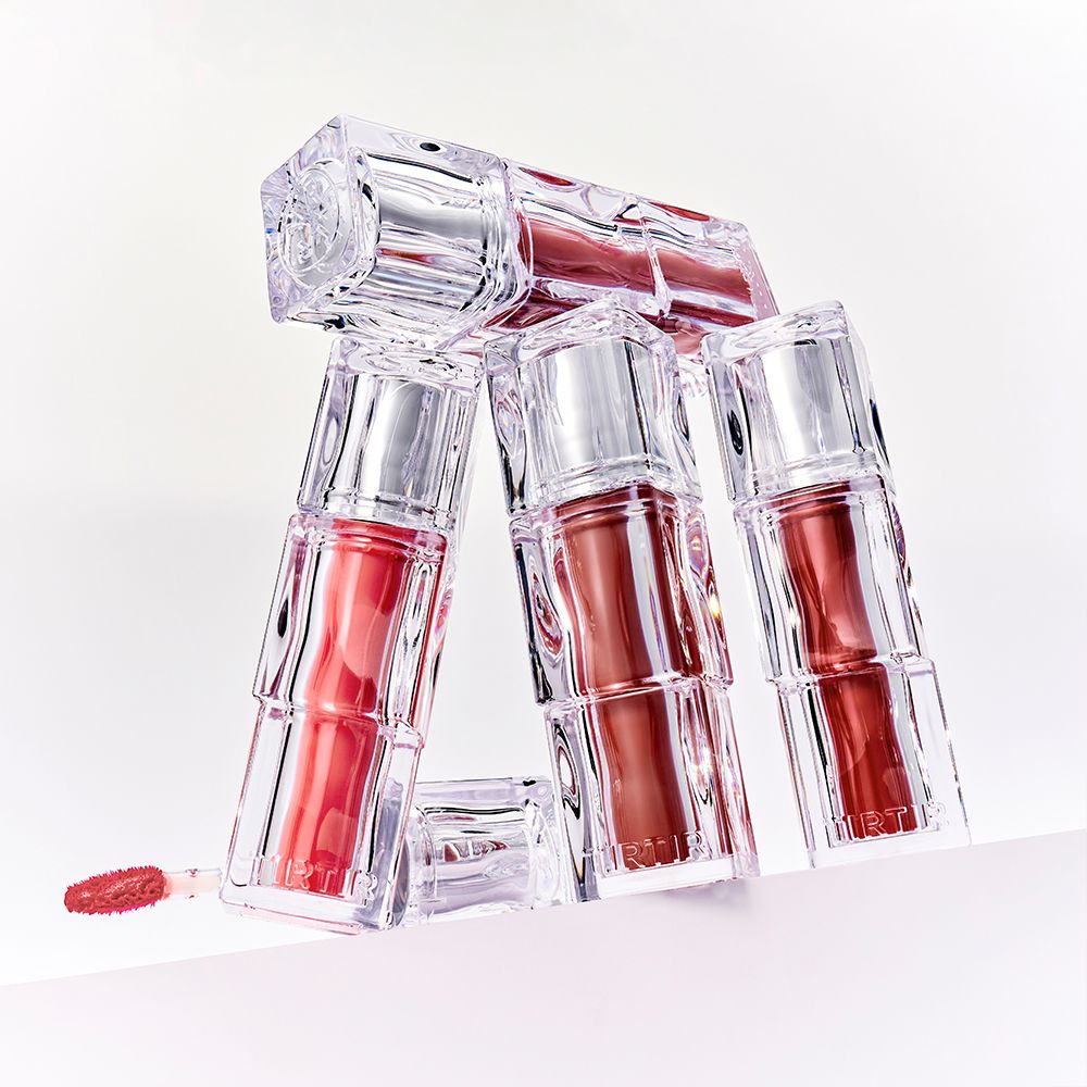 Boccette impilate di TIRTIR Waterism Glow Tint in confezione trasparente.