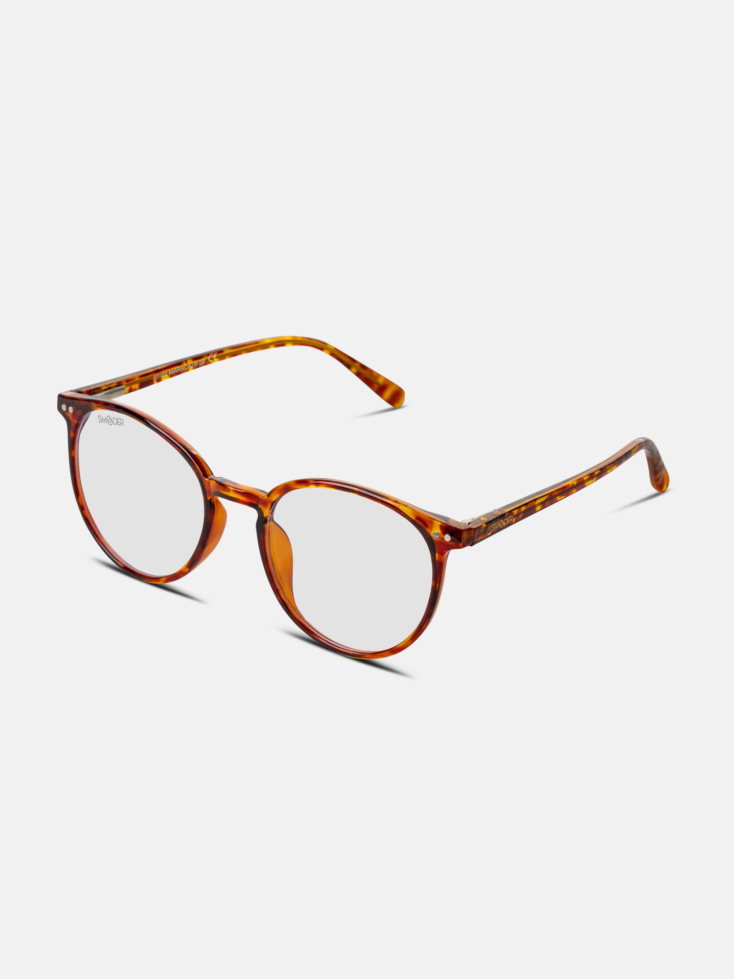 Occhiali rotondi, montatura tartarugata. Lenti chiare, aste marroni. Marchio Smooder in alto.