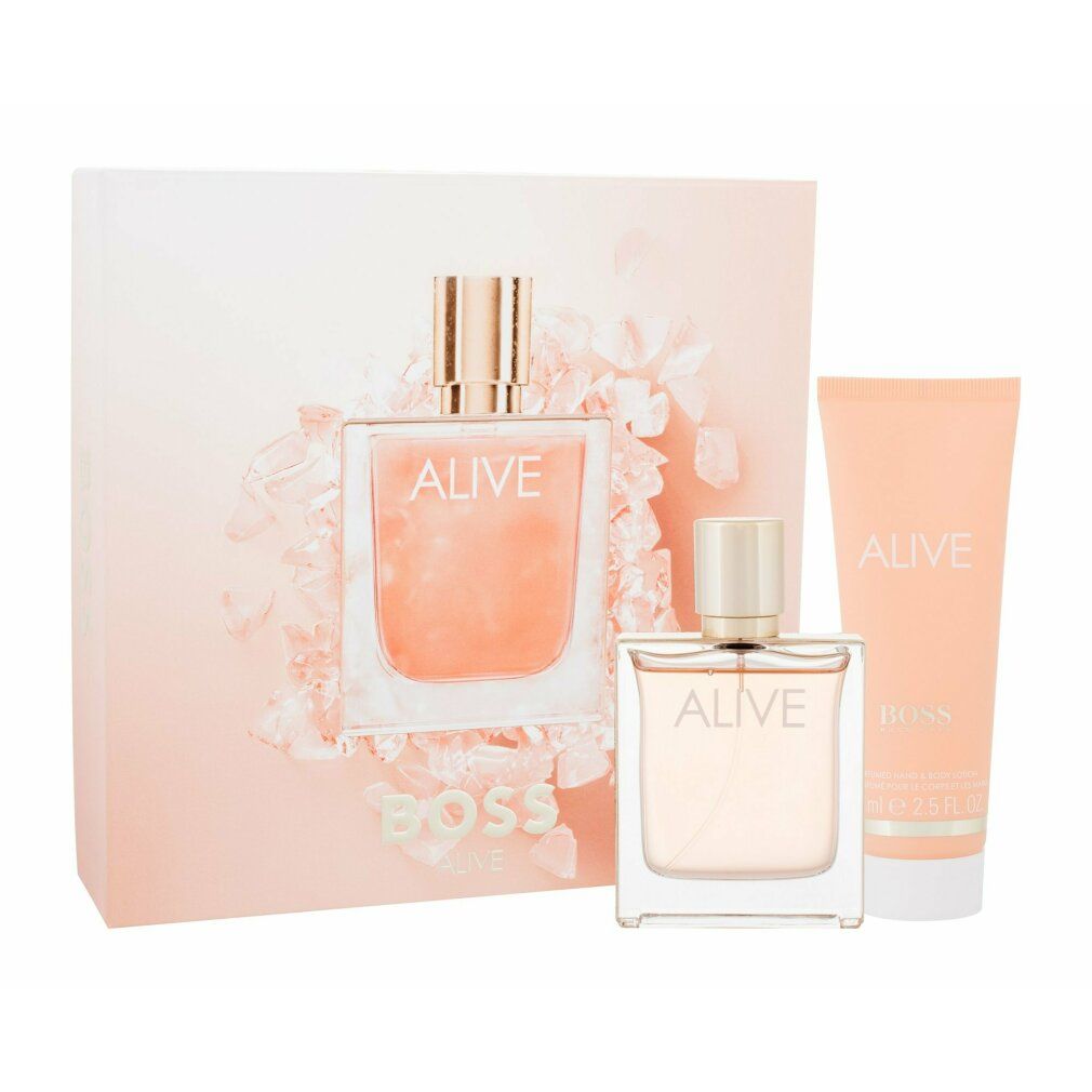 Set regalo con flacone di profumo, crema e scatola. Scritta "ALIVE" e "BOSS". Tonalità rosa.