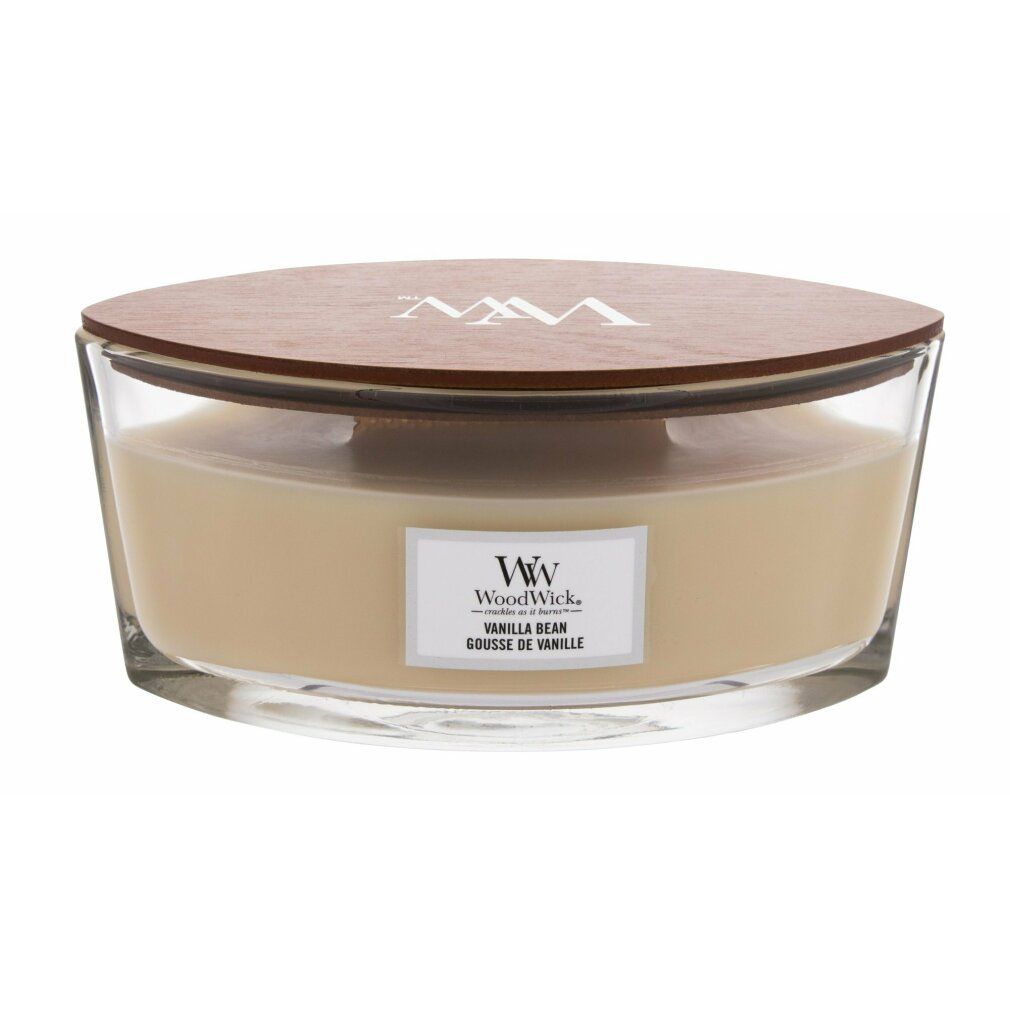Candela in vetro, coperchio in legno. Etichetta "WoodWick Vanilla Bean".