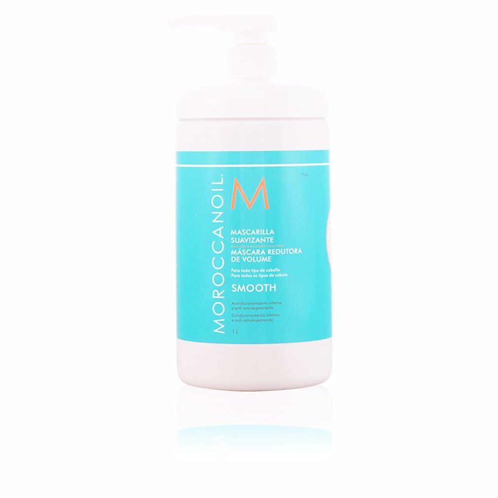 Contenitore bianco con etichetta blu. Scritta Moroccanoil, Mascarilla Suavizante, M. Con pompa.